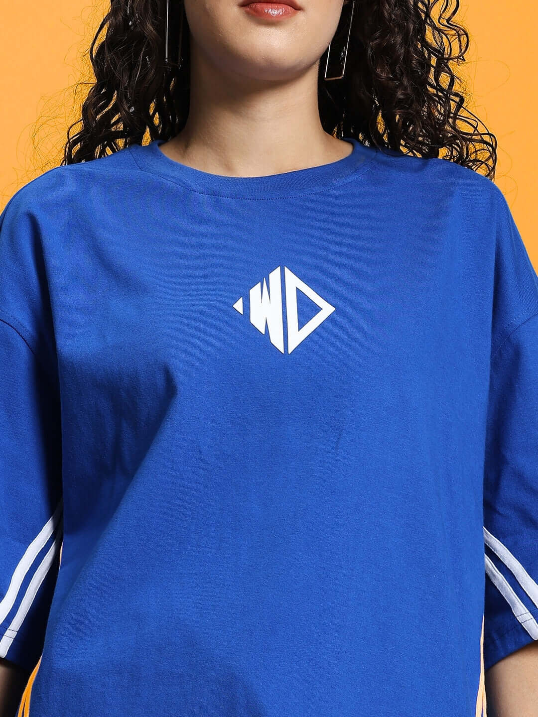 Women's oversized t-shirt in royal blue, featuring premium cotton French terry material and unique white logo on front.