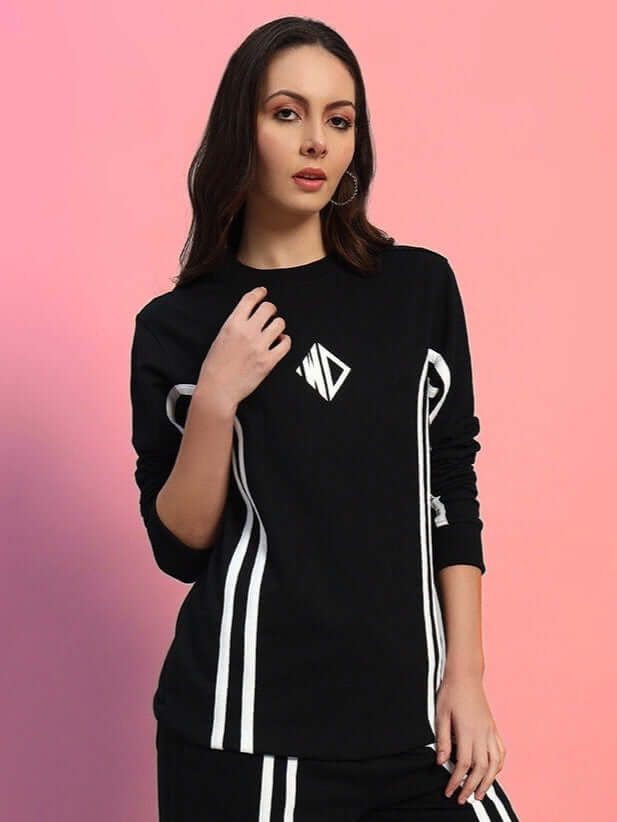 Model wearing WOMEN'S OUTLOOK SWEATSHIRT BLACK WITH WHITE STRIPE, showcasing sporty design and streetwear style.