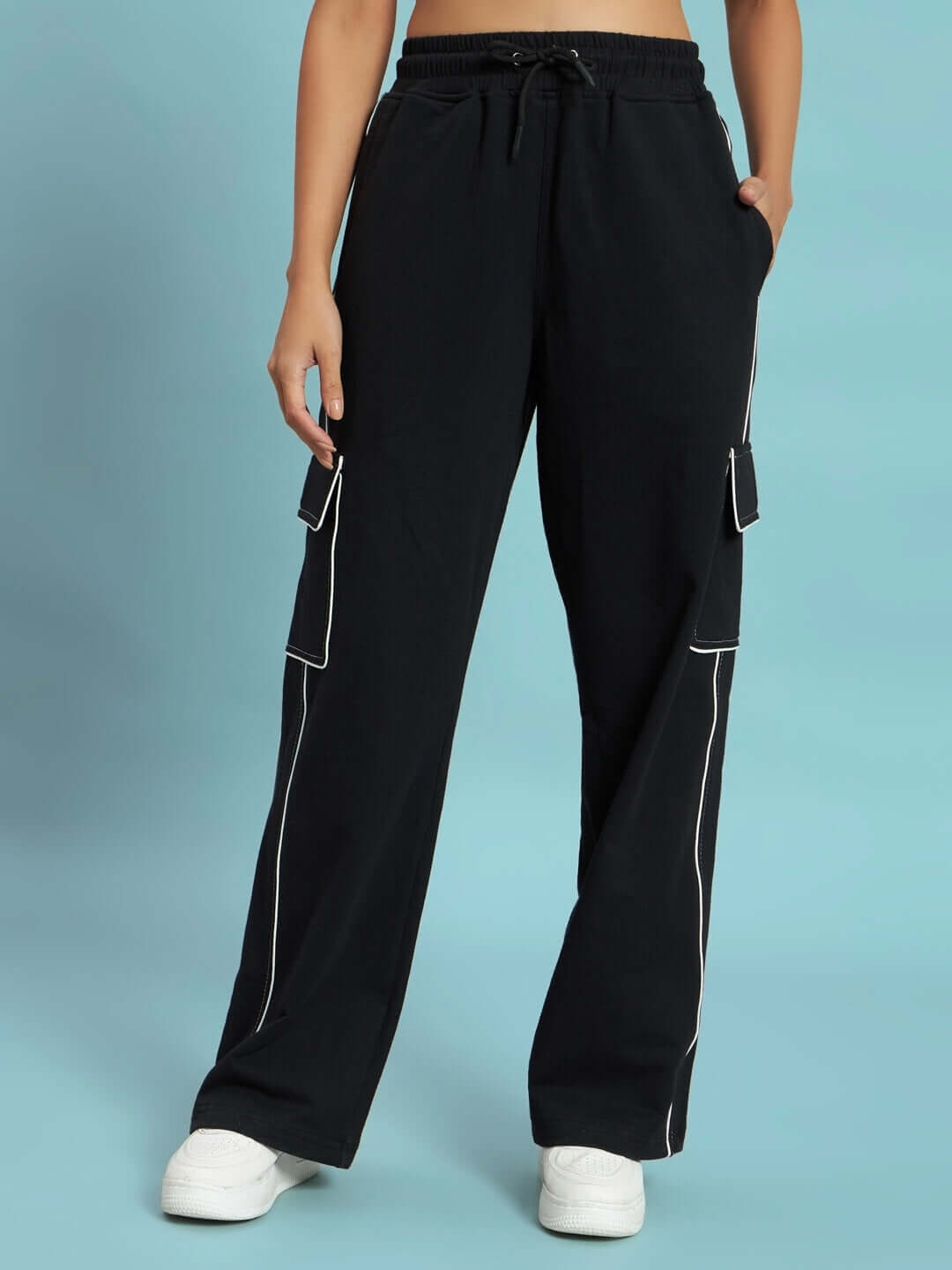 Women's black cargo pants with contrast stitching, featuring pockets and a relaxed fit, perfect for customized orders.