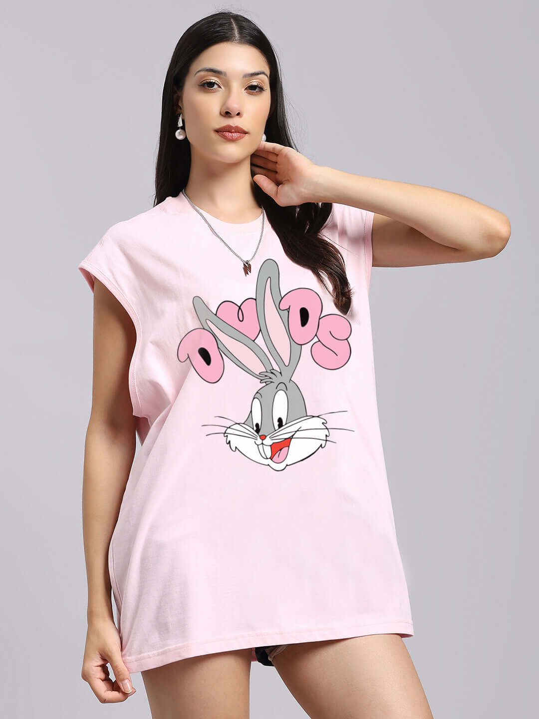 Woman wearing WOMENS COOL BUNNY PRINTED T-SHIRT PINK with bunny graphic print, casual fashion.