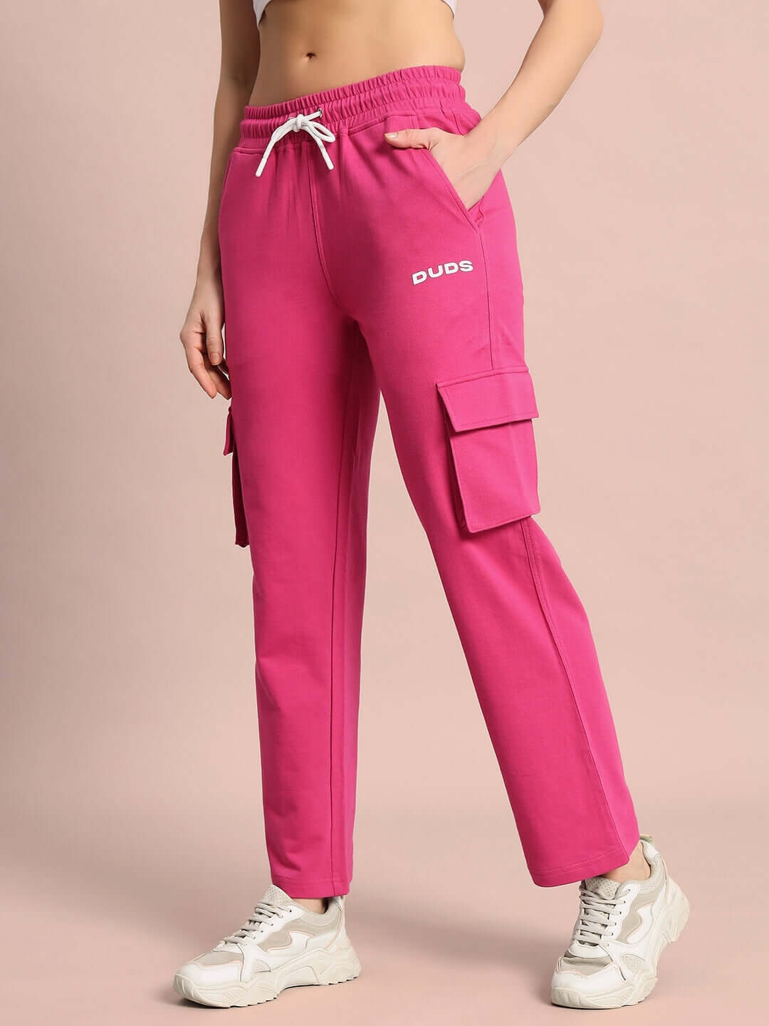 Women's pink Merriam joggers by DUDS, featuring cargo pockets and drawstring waist; customizable size available.