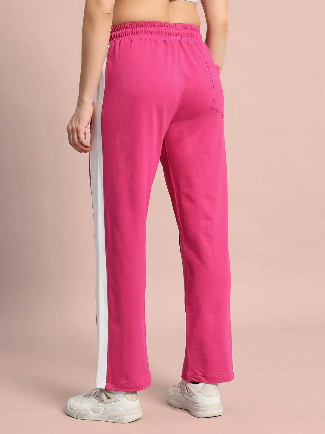 Women's pink side seam joggers with white stripe, made-to-order by DUDS, shown from the back.
