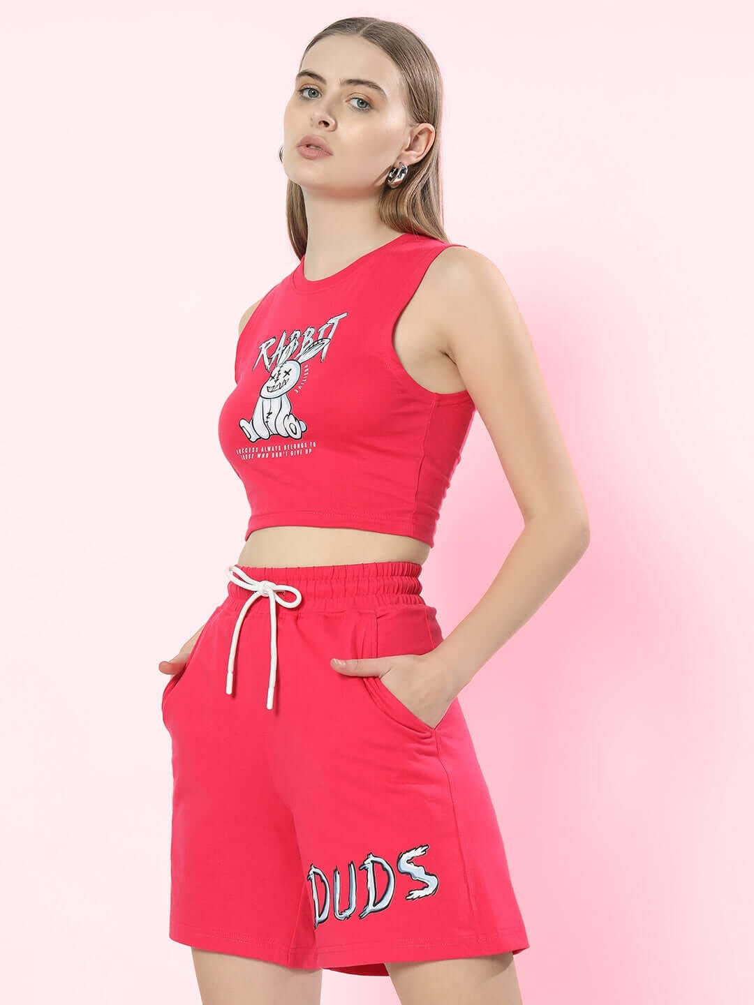 Model wearing pink women's rabbit print co-ord set, featuring a sleeveless top and shorts, crafted from premium cotton French terry fabric.