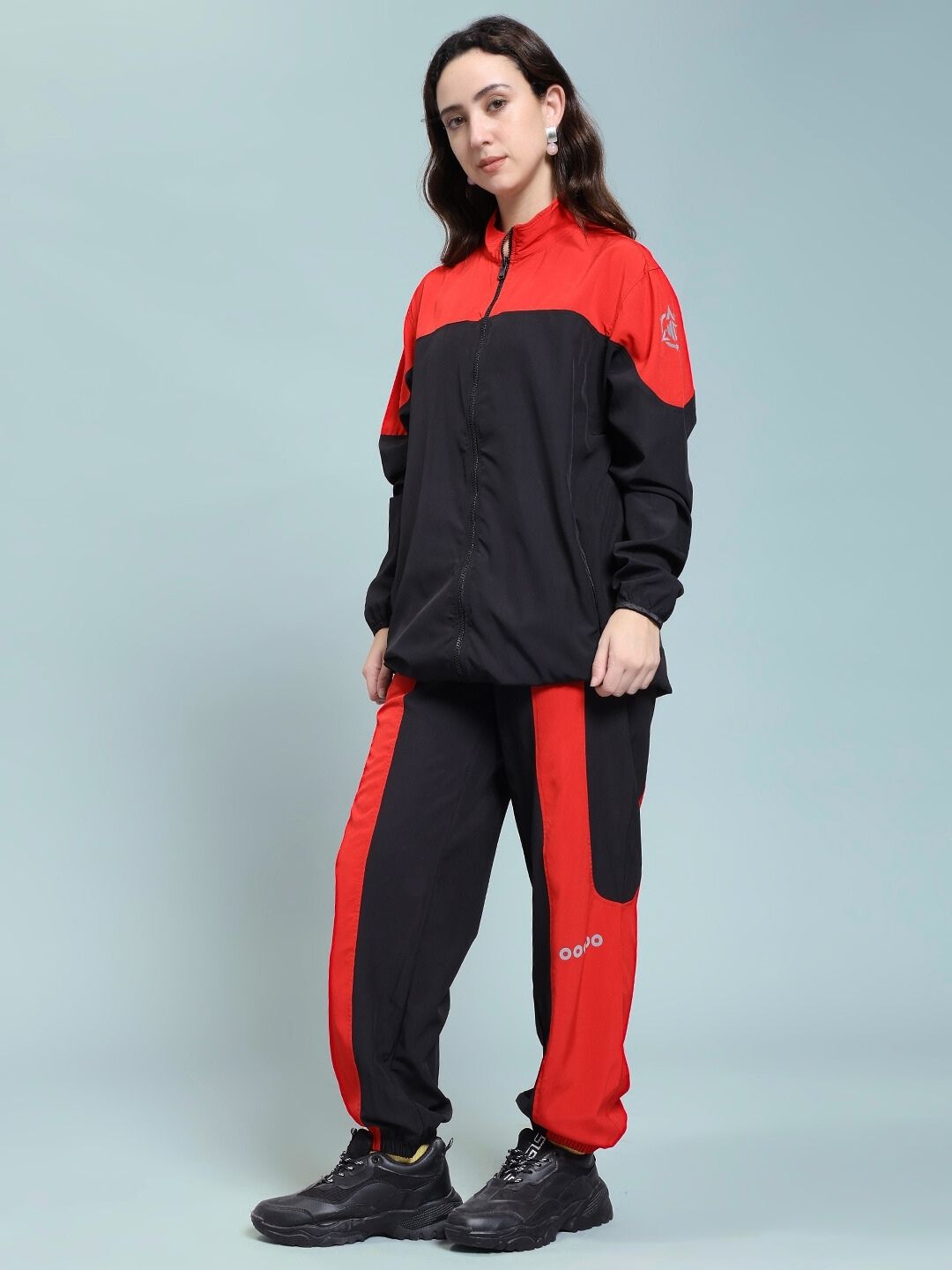 Woman wearing WOMEN POWER BLOCK CO-ORD SET BLACK RED, showcasing sporty and sleek design.