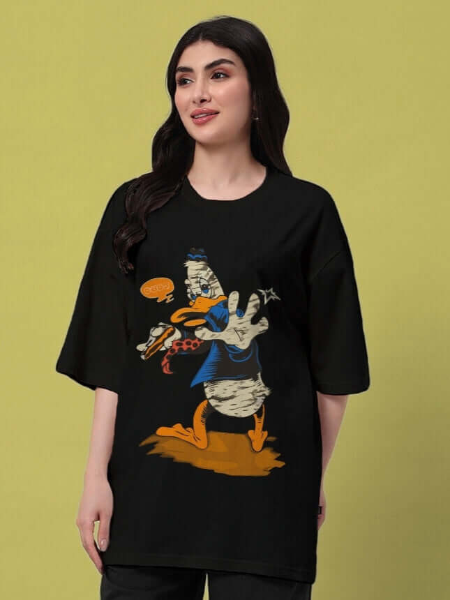 Woman wearing black oversized t-shirt with a cartoon duck graphic.