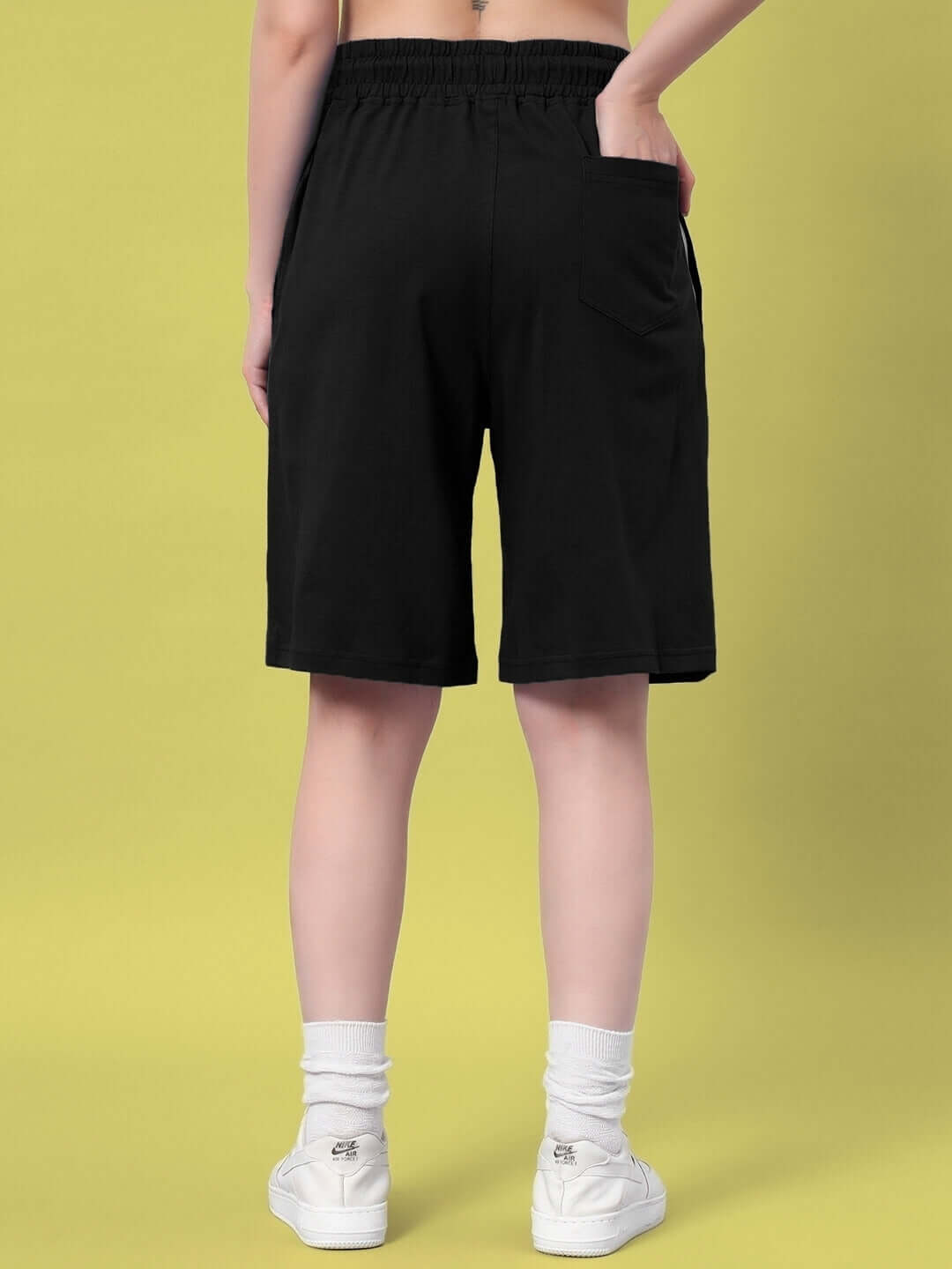 Back view of women's black Quack Off summer shorts, showcasing the relaxed fit and pocket detail, perfect for casual wear.