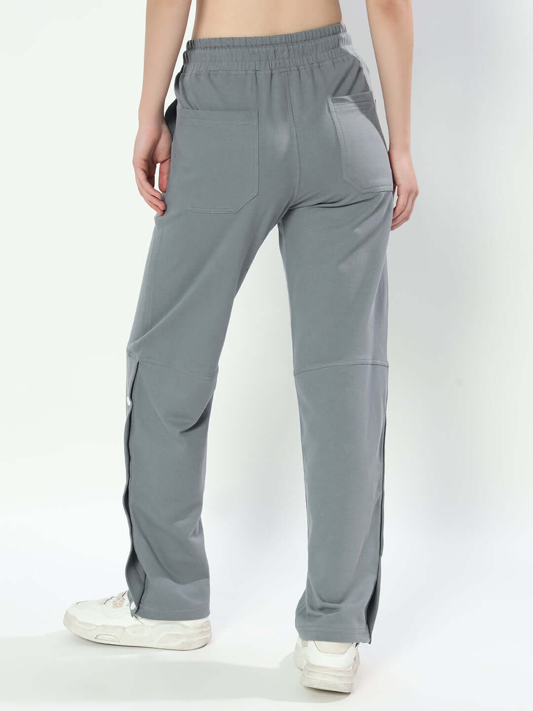 Back view of women's grey racer joggers, highlighting the relaxed fit and elastic waistband. Ideal for custom size options and comfort.