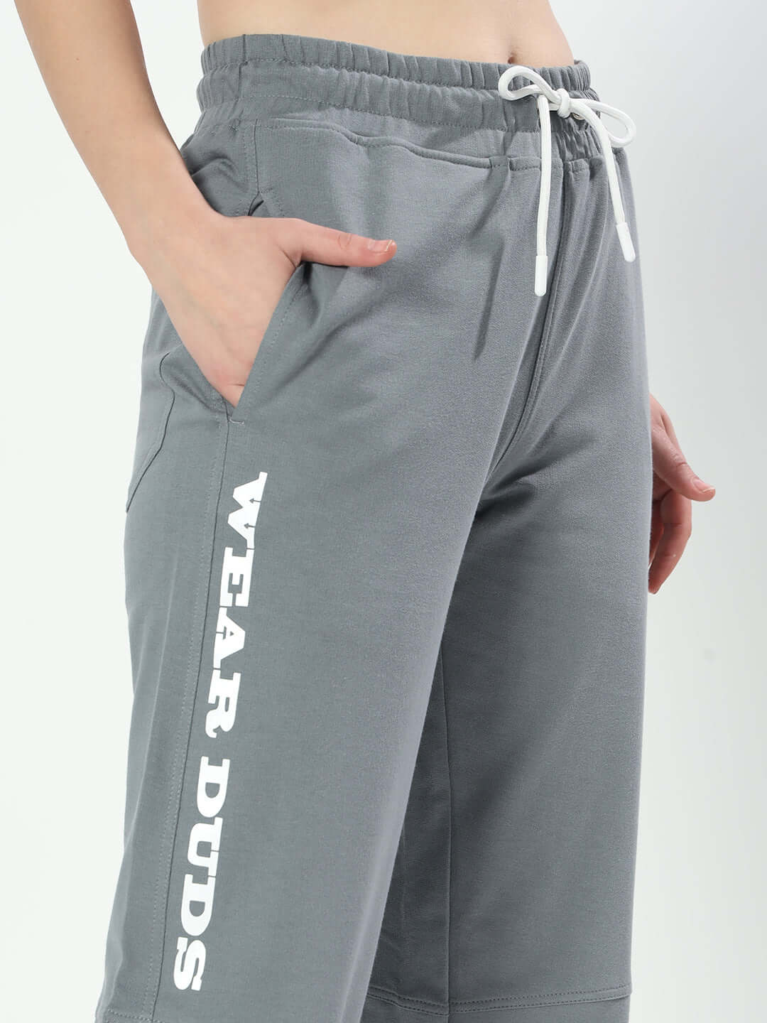Woman wearing grey Women's Racer Joggers with 'Wear Duds' text, featuring an elastic waistband and drawstring for a custom fit.