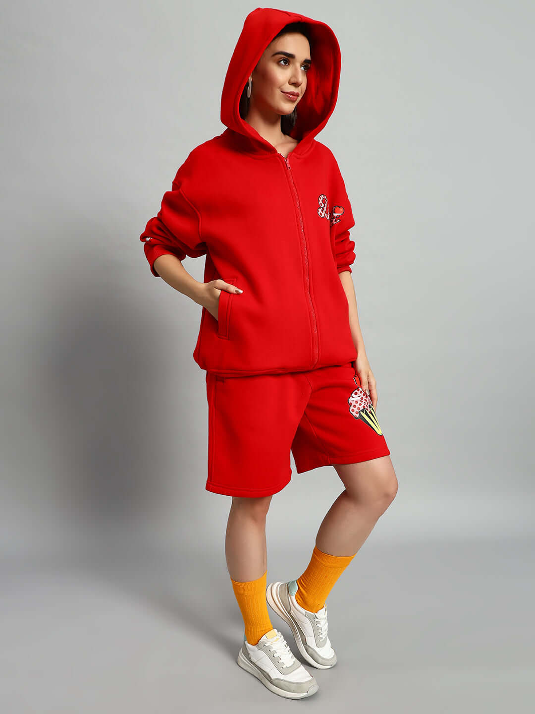 Woman wearing WOMEN CUPCAKE FLEECE CO-ORD RED, featuring a red fleece hoodie and joggers, showcasing casual streetwear style.