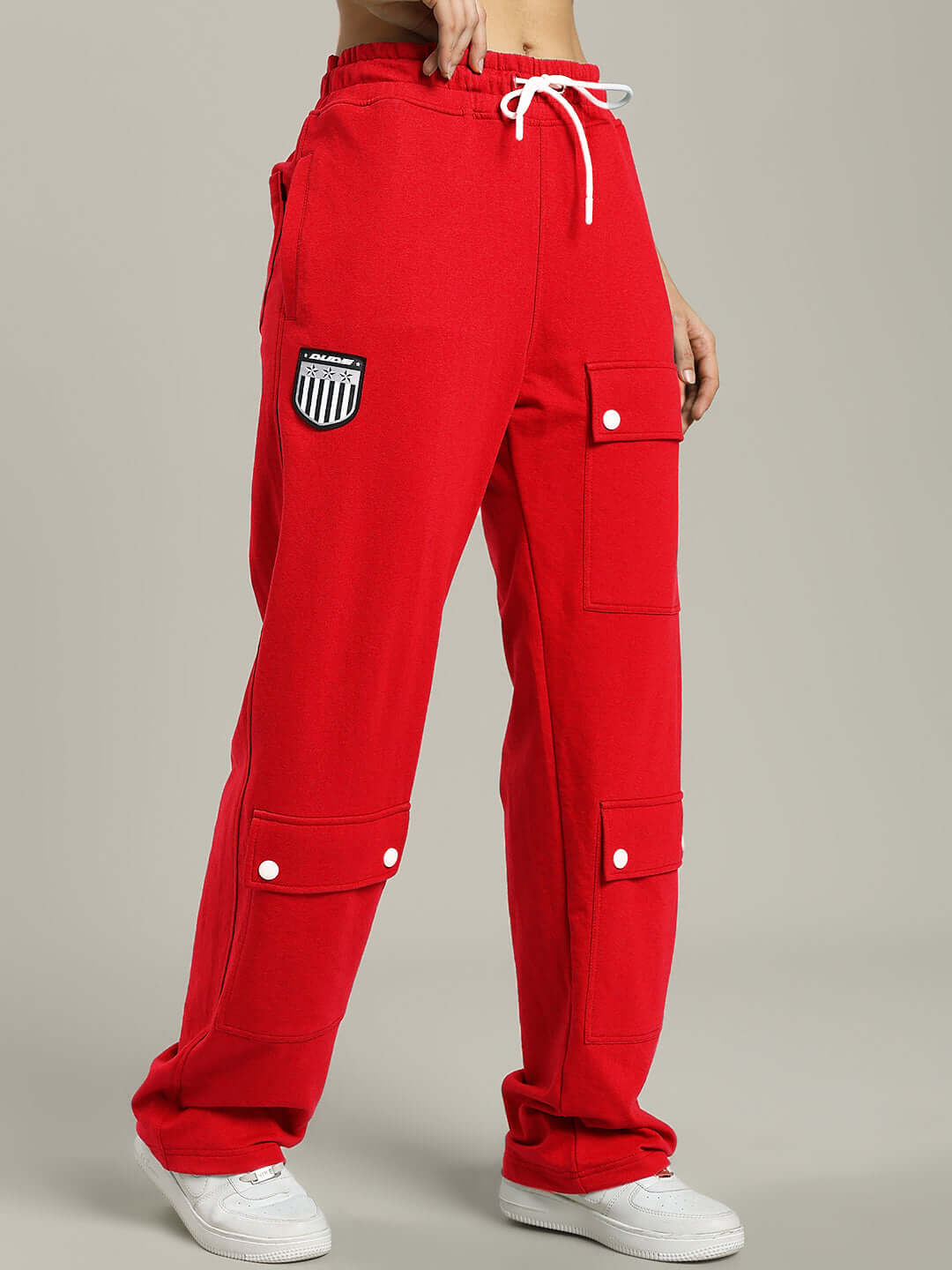 Women's red baggy joggers with flap pockets, featuring a custom fit option, made by DUDS tailors. Shipping takes 7-10 days.