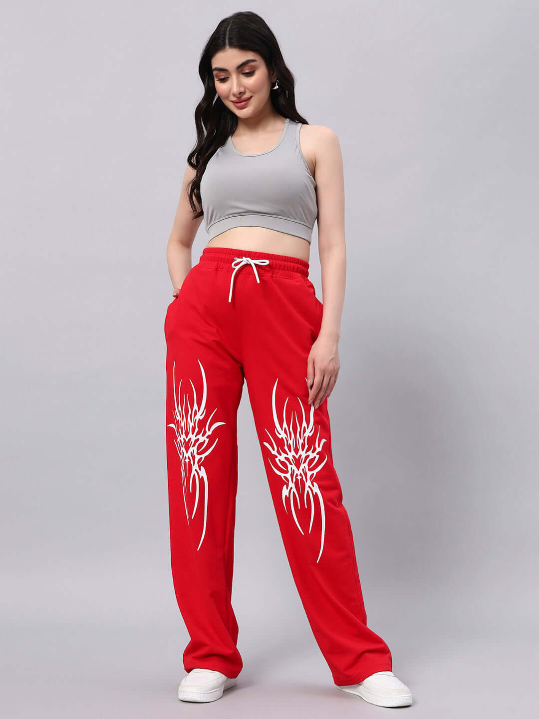 Model wearing WOMEN'S REDX BRANCHING JOGGER RED with unique white pattern.