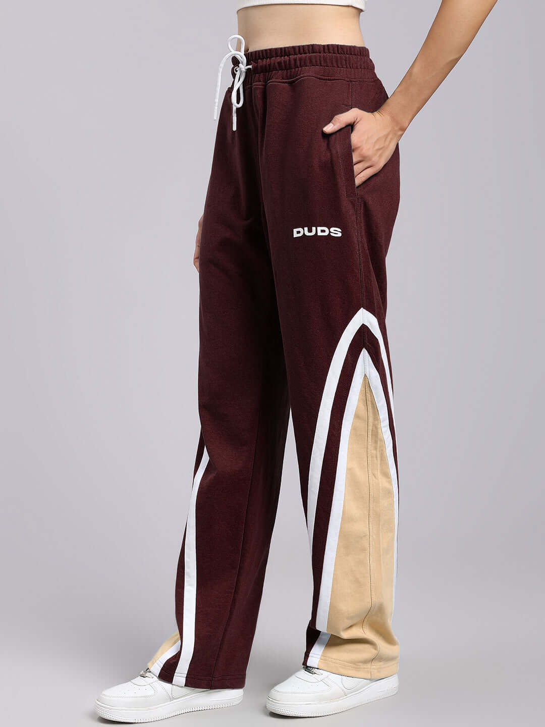 Women's Rio One Relaxed Fit Joggers in Maroon with side stripe, displayed from one side, highlighting the style and fit.