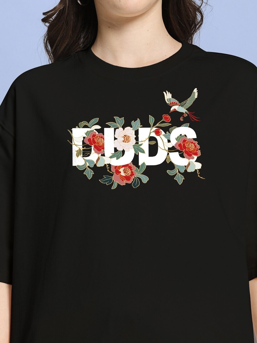 Close-up of WOMEN ROSE CHARM RELAXED FIT CO-ORD SET BLACK with floral print and bird detail, perfect for casual outings or relaxed events.