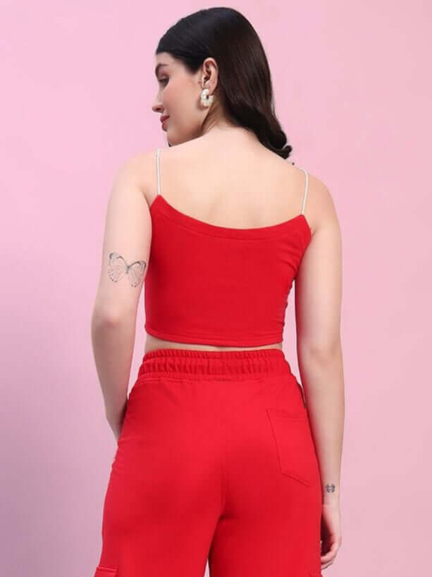 Woman wearing a red Rosella crop-top made of premium heavy gauge 100% cotton fabric. Stylish and perfect for casual wear.