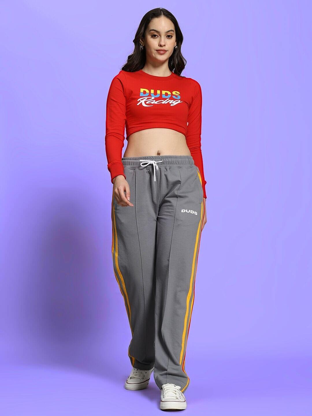 Woman wearing red-grey racing print co-ord set with relaxed joggers, elasticated waistband, premium cotton blend, by Dubs Clothing.