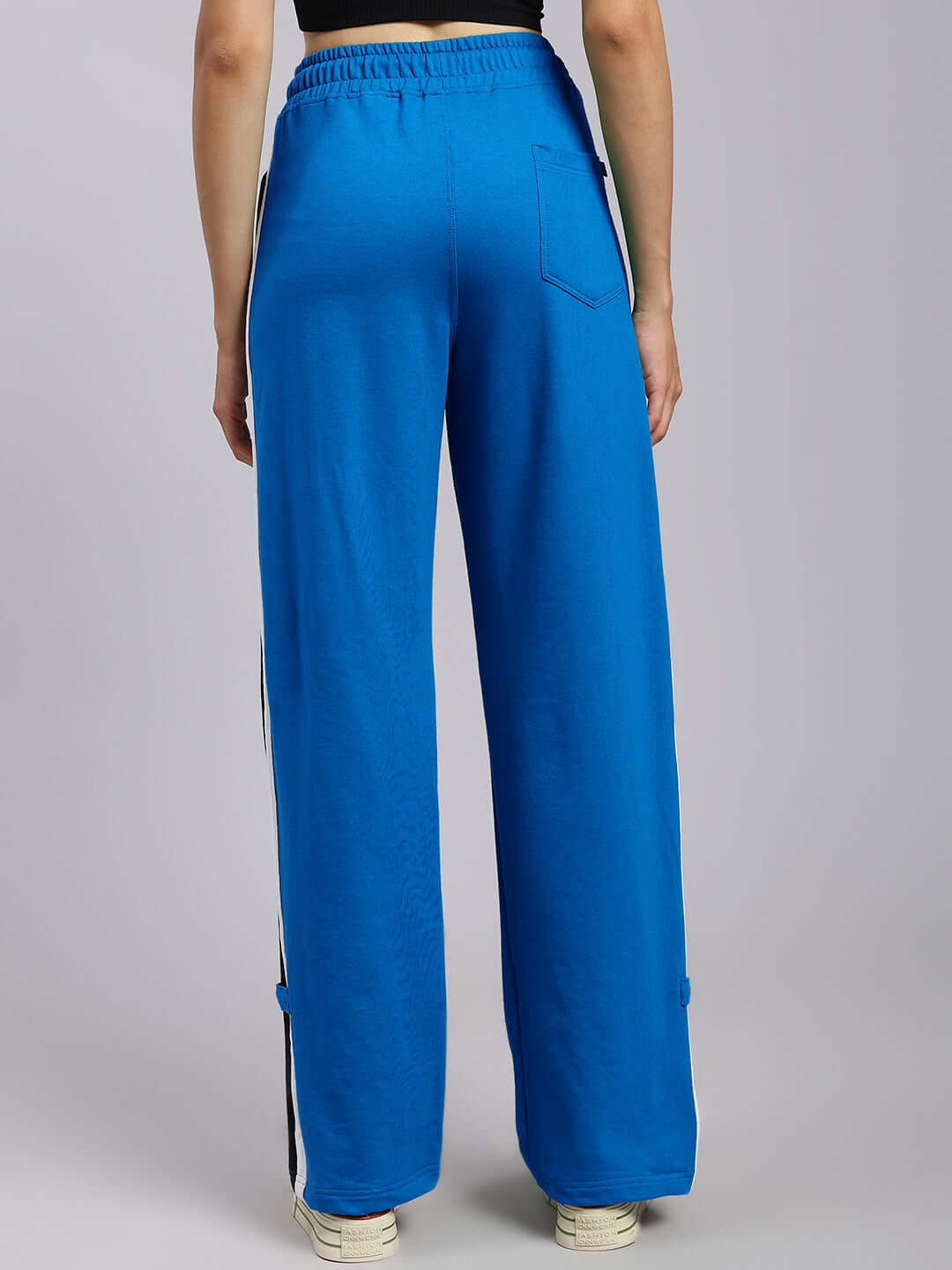 Back view of Women's RossTOn Relaxed Fit Blue Joggers, made to order by skilled tailors at DUDS, featuring a relaxed fit design.