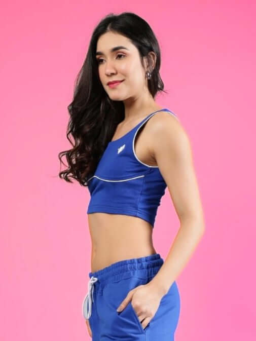 Model wearing Women's Lias Fitted Crop Top in Royal Blue styled with matching pants, made from premium cotton and elastane fabric.