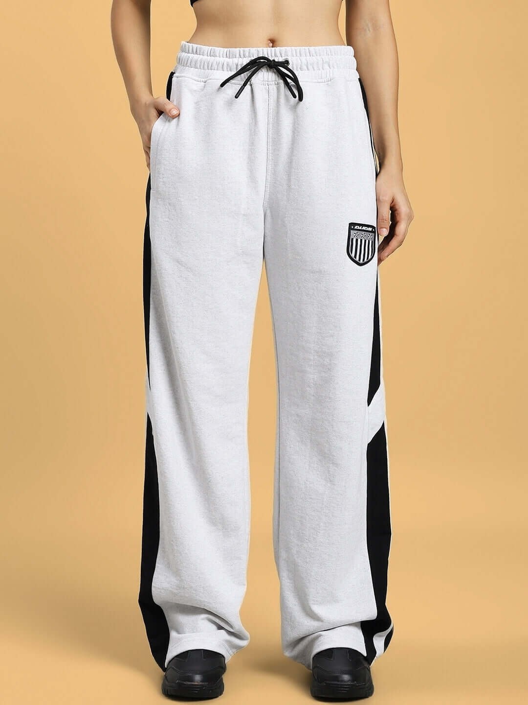Model wearing Women's Royalson Joggers in melange grey, featuring customizable fit, crafted by DUDS.