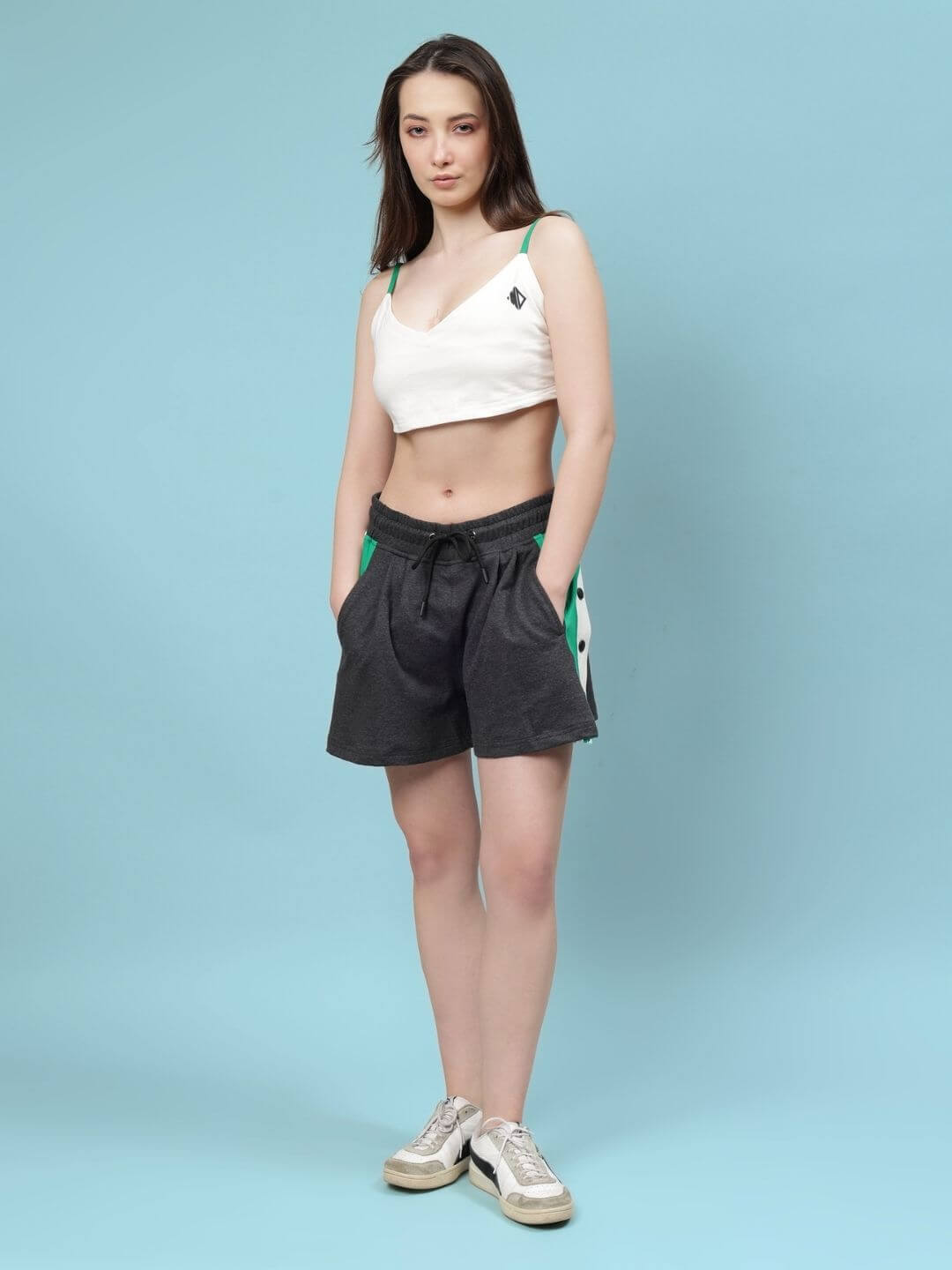 Woman wearing WOMEN'S SAMMIE CO-ORD SET OFF WHITE-DARK GREY on light blue background