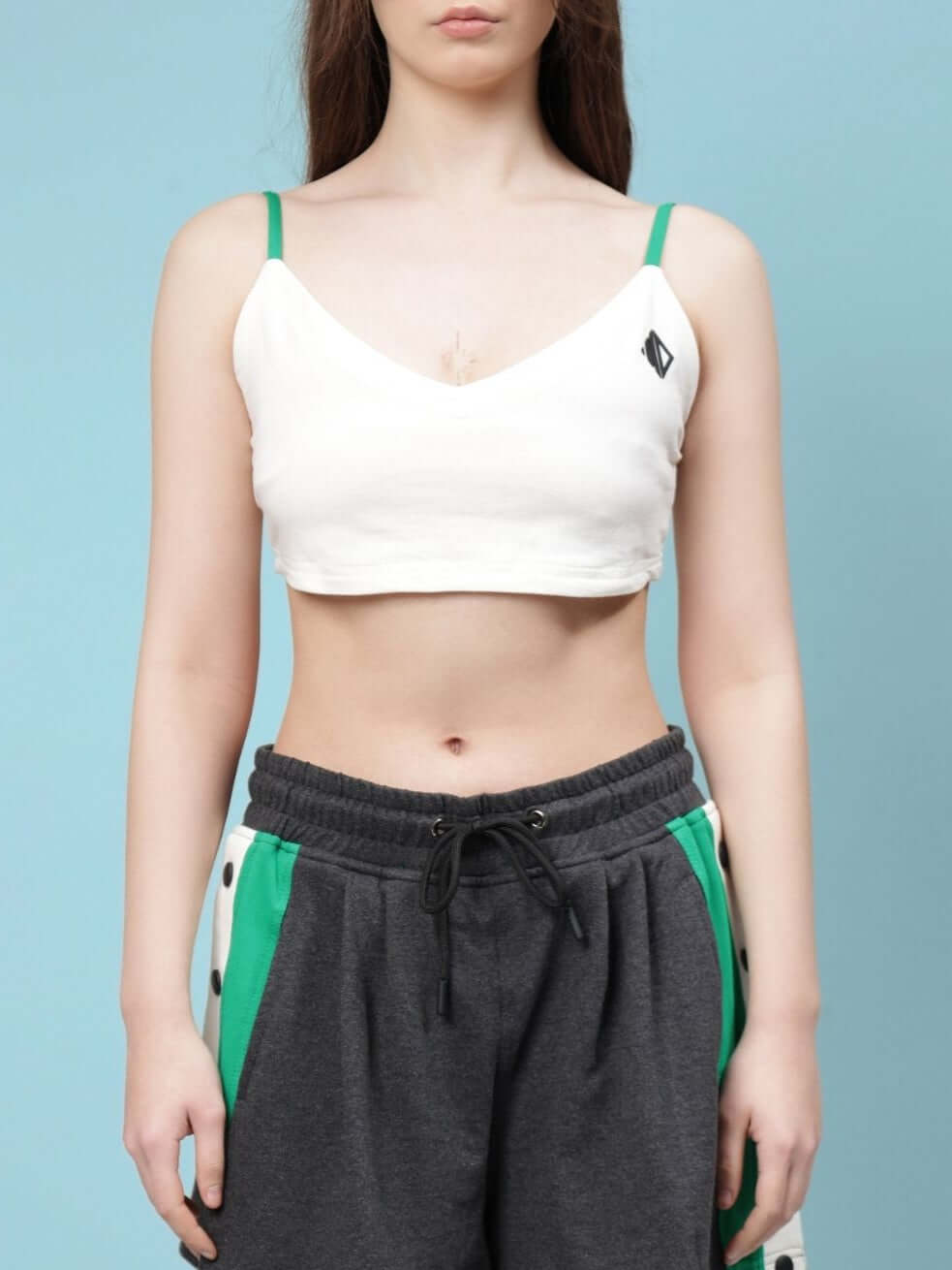 Off-white women's Sammie crop-top in premium cotton fabric, displayed on a model, featuring adjustable straps and a comfortable fit.