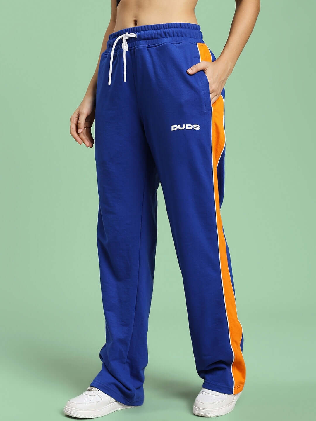 Women's Sanford Stripe Joggers in blue with orange side stripes, featuring a drawstring waist and DUDS logo, made to order by skilled tailors.