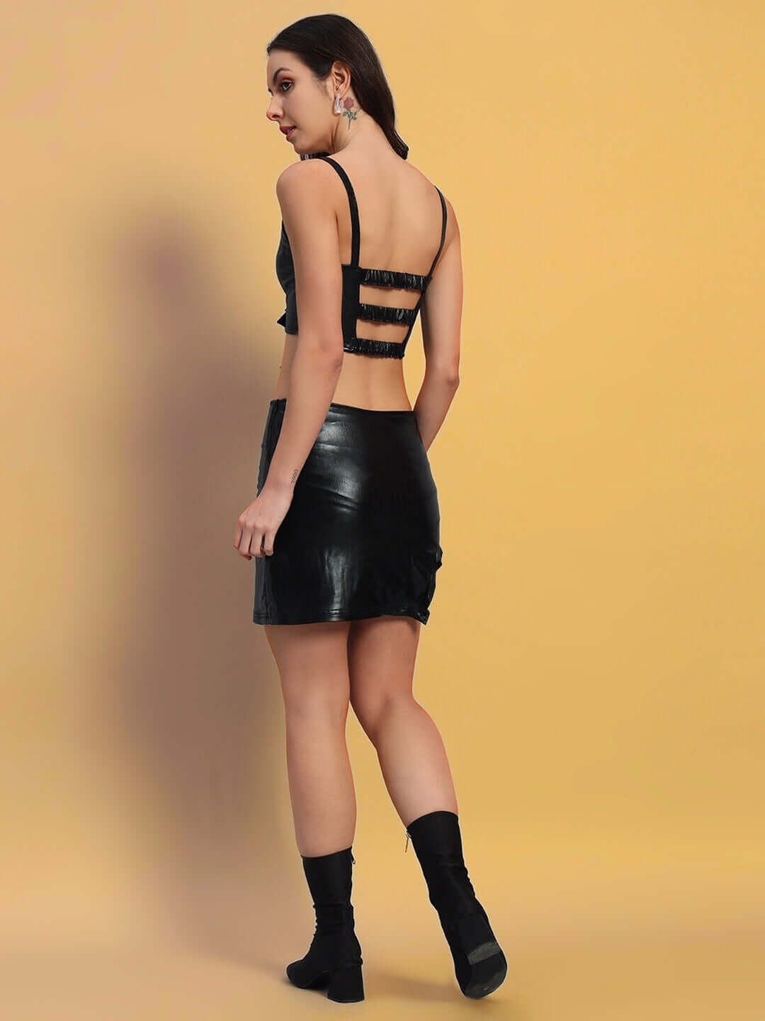 Back view of a woman wearing WOMEN'S SAVOUR CO-ORD SET BLACK showcasing chic minimalism and tailored fit.
