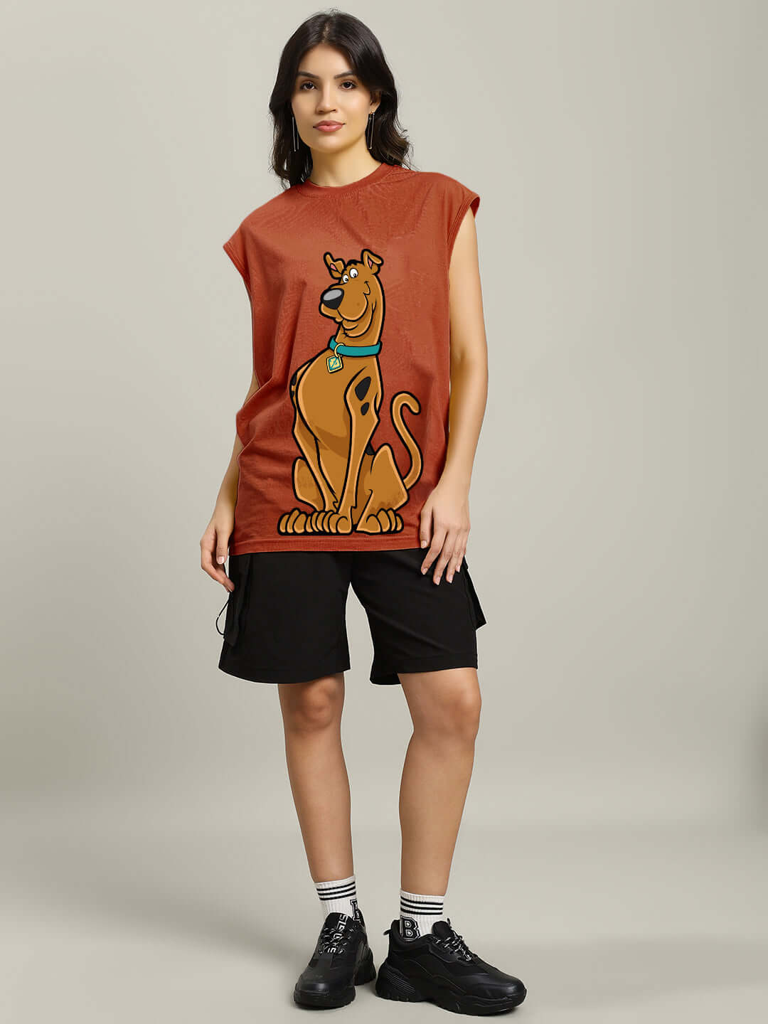 Model wearing Scooby Doo brown gym t-shirt, customizable size option available, featuring classic cartoon character design.