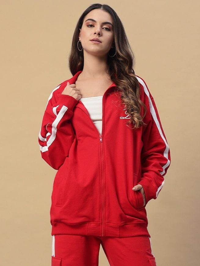 Woman wearing red women's Scotia jacket by DUDS with white stripes, available for custom fit and made to order, front view.