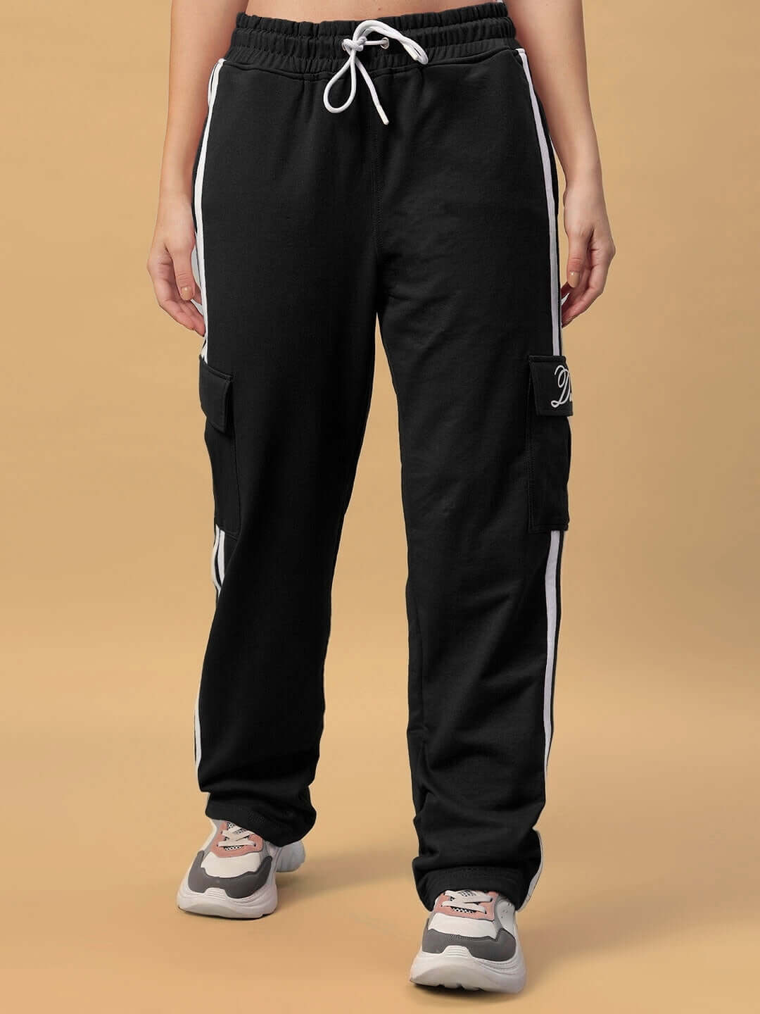 Women's Scotia Stripe Joggers in Black with white side stripes, featuring cargo pockets and an elastic waistband.