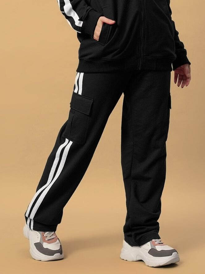 Model wearing Women's Scotia Stripe Joggers in black with side stripes, showcasing casual and comfortable fit by DUDS.