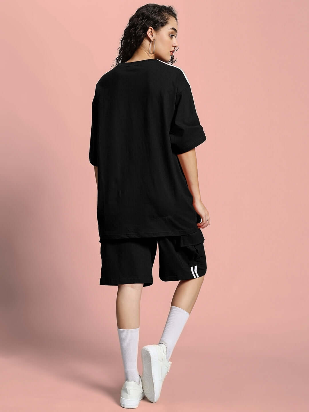 Model in WOMEN'S SCOTIA SUMMER CO-ORD SET BLACK showcasing relaxed fit.