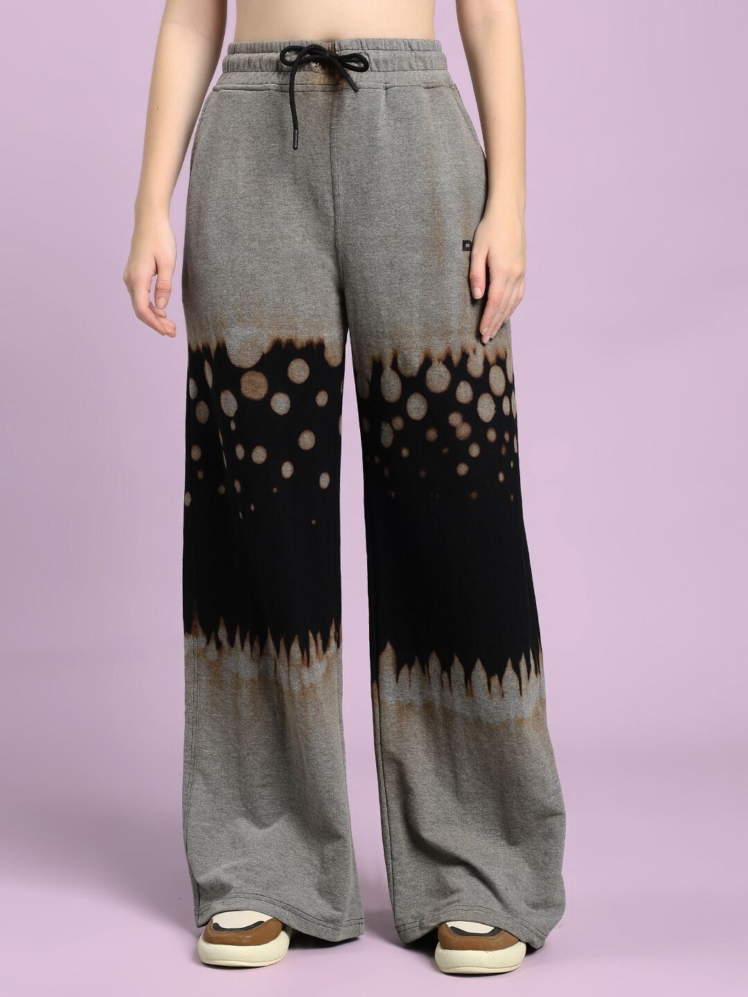 Model wearing WOMEN'S SHADOW SWIRL TIE-DYE JOGGER BLACK with unique shadow swirl tie-dye pattern, ideal for athleisure and comfort.