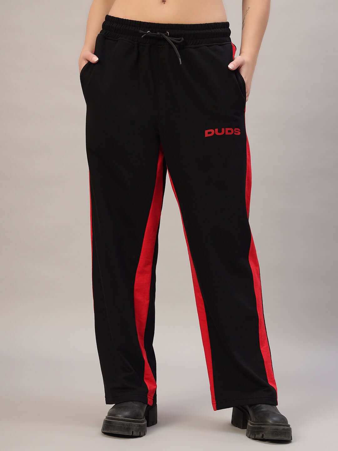 Women's black and red side seam baggy joggers by DUDS, featuring a relaxed fit and custom size options.