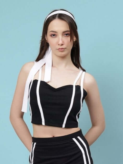 Woman wearing a black Simone crop-top with white stripes, made from premium heavy gauge fabric, 100% cotton, by Color By Colours.