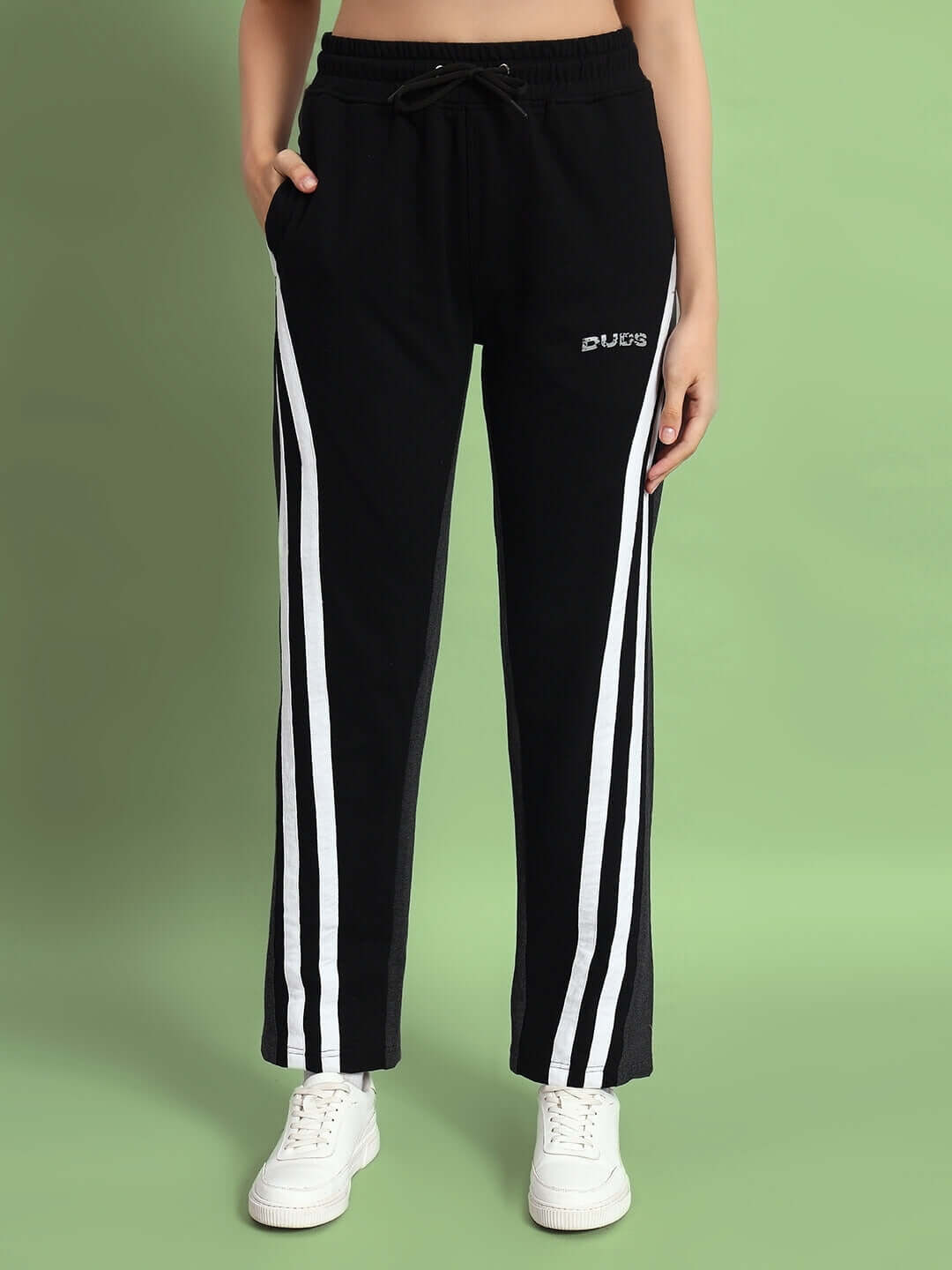 Women's skater Korean baggy joggers in black and grey, made by DUDS, featuring white side stripes and drawstring waist.