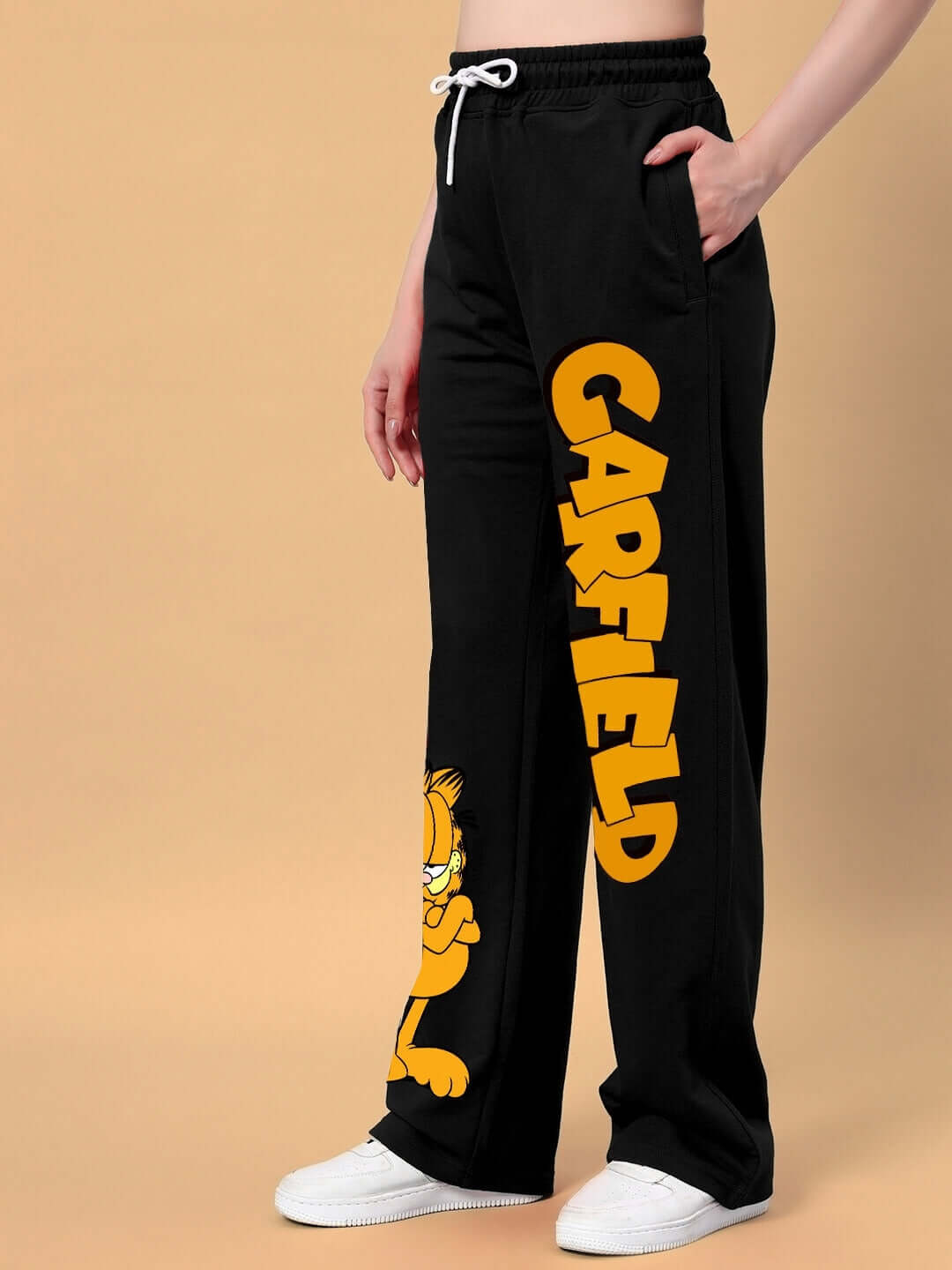 Women's Garfield Relaxed Fit Jogger in Black, featuring bold yellow lettering and Garfield graphic, comfortable and customizable fit.