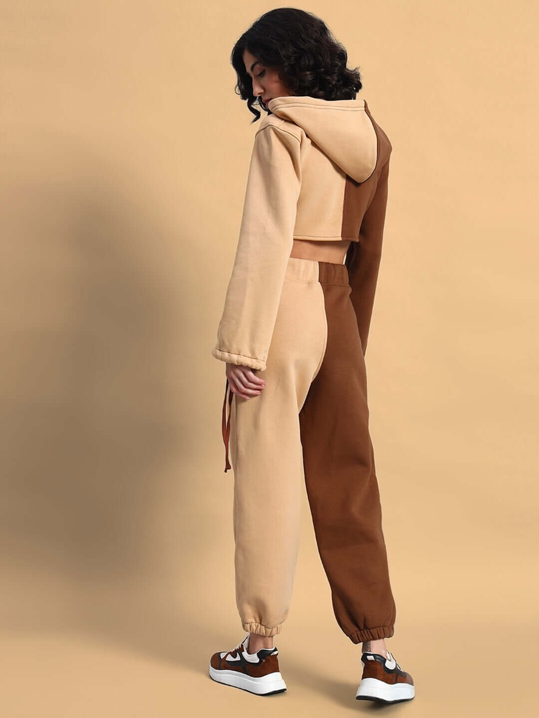 Model wearing WOMEN'S SOPHIA CO-ORD SET in beige-brown, showcasing the comfortable chic fit from behind.