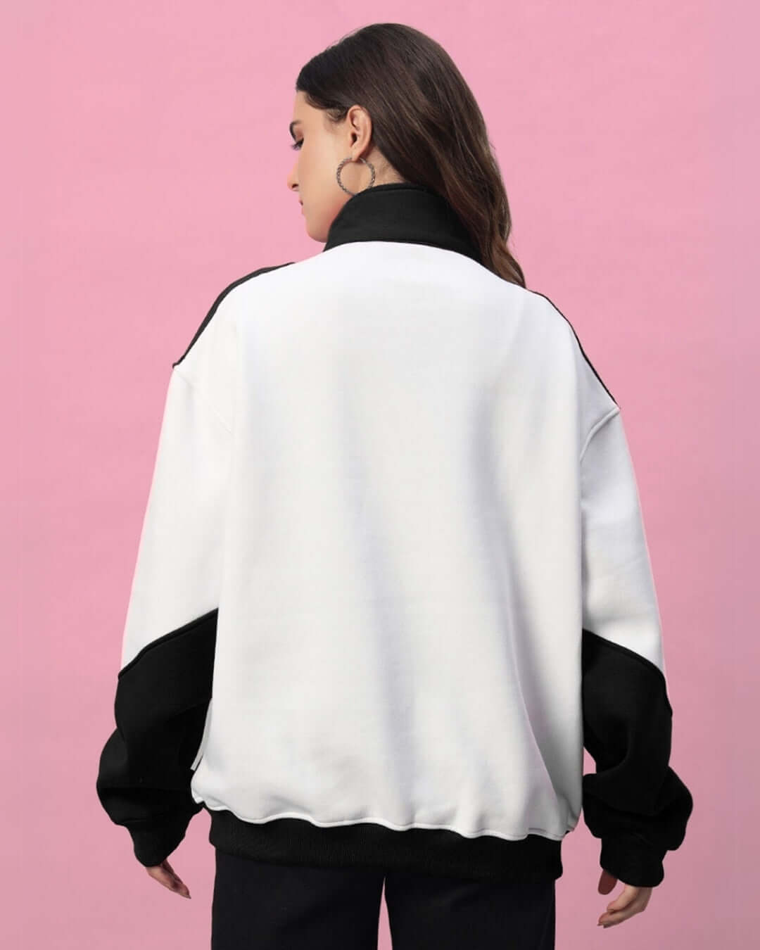 Woman wearing Women's Speeding Colorblock Jacket in black and white, showcasing a relaxed fit and modern streetwear design.