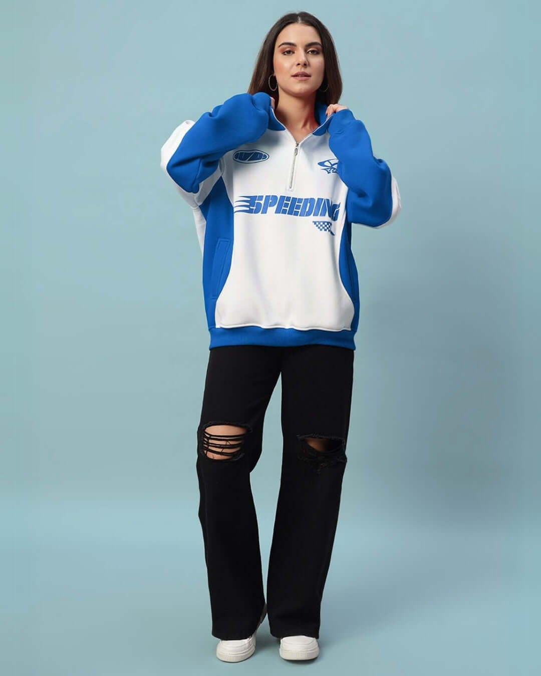 Woman wearing a Women's Speeding Colorblock Jacket in royal blue, featuring a bold sporty look with relaxed fit and full sleeves.