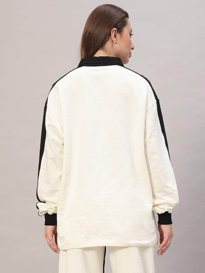 Back view of women's oversized sweatshirt in off white-black, premium cotton fabric, highlighting design and style.