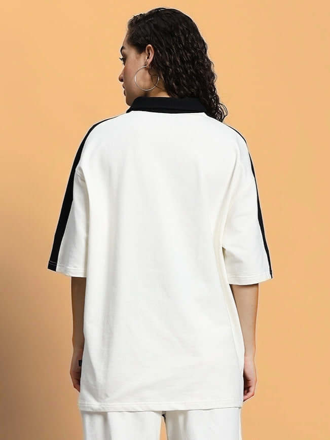 Back view of women's oversized off-white T-shirt with black accents, made of premium cotton and elastane. Perfect for casual wear.