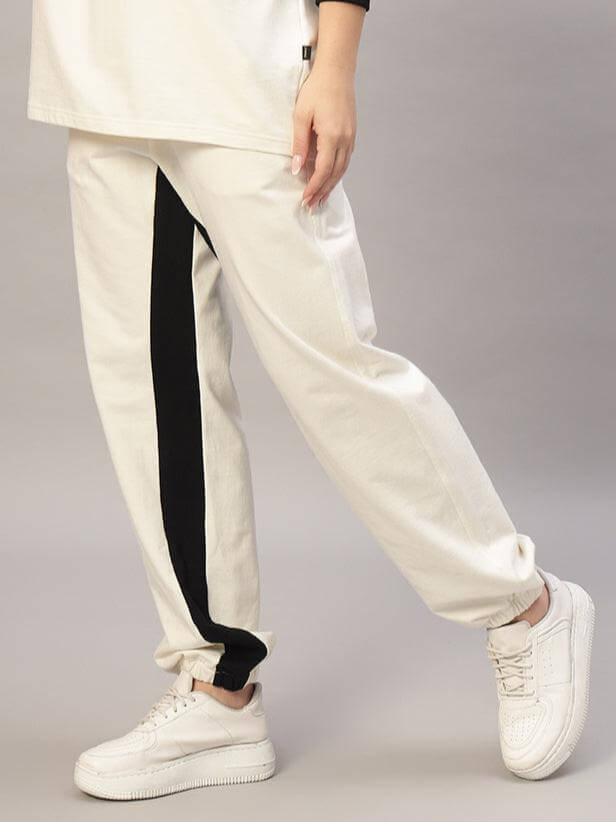 Off-white joggers with black side contrast from DUDS, showcasing women's casual fashion with a customizable fit option available.