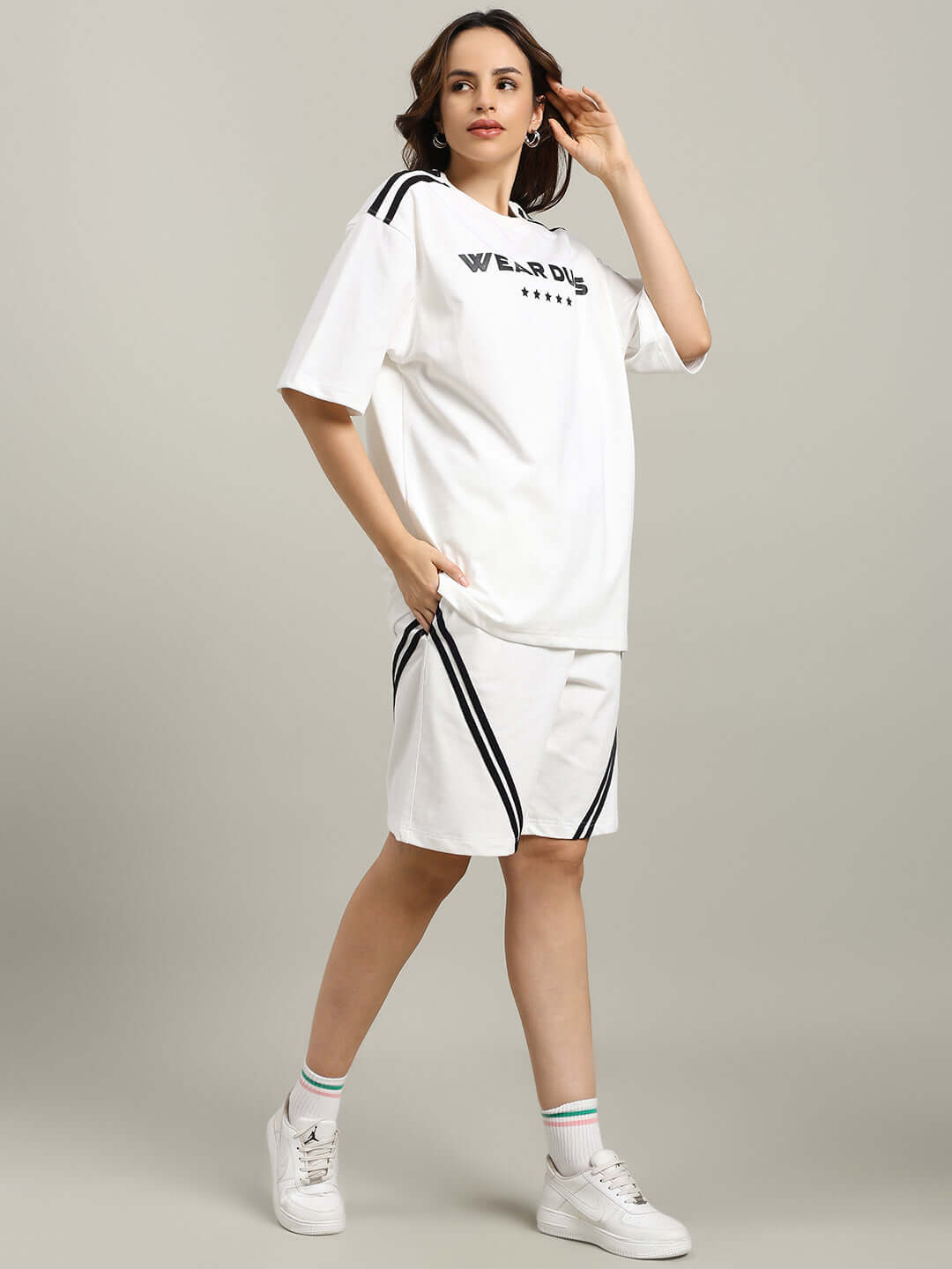 WOMEN'S STAR JUMPER REGULAR FIT SHORTS OFF WHITE featuring a stylish design with black stripes, perfect for casual wear.