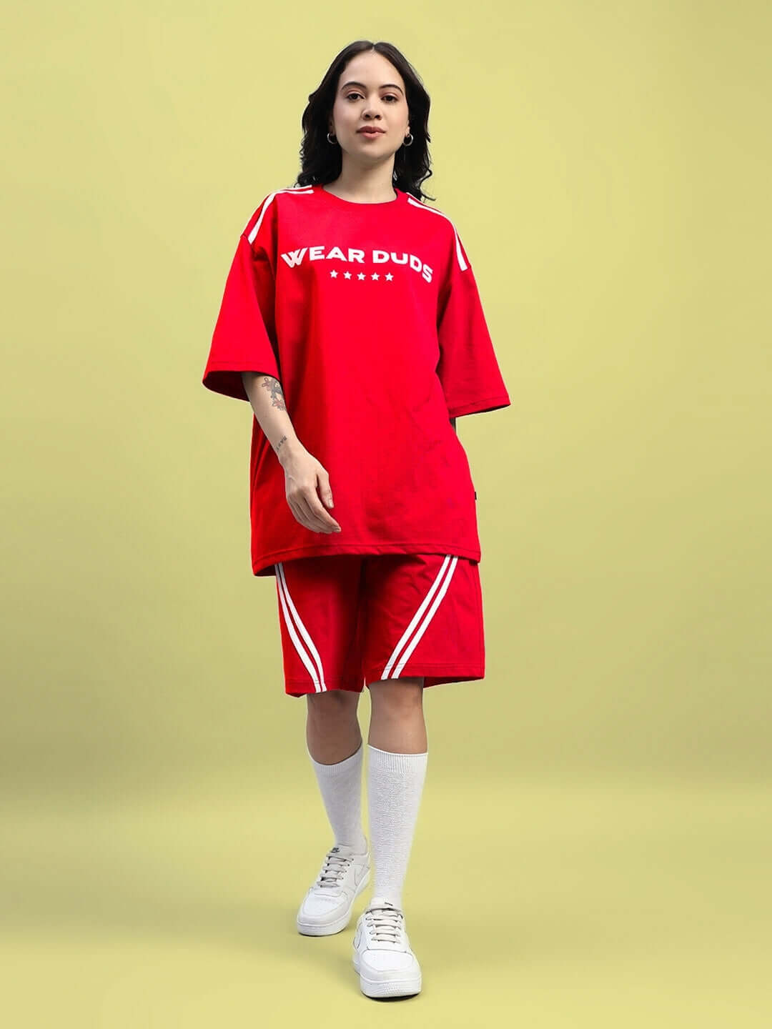 Woman wearing red Women's Star Jumper Summer Co-Ord Set, featuring premium cotton and elastane fabric, perfect for a casual summer look.