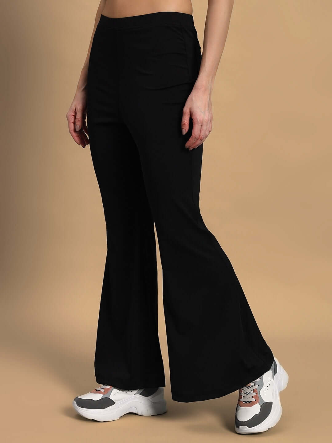 Woman wearing black women's Stella boot cut pant from DUDS, showcasing stylish custom fit option for a tailored look.