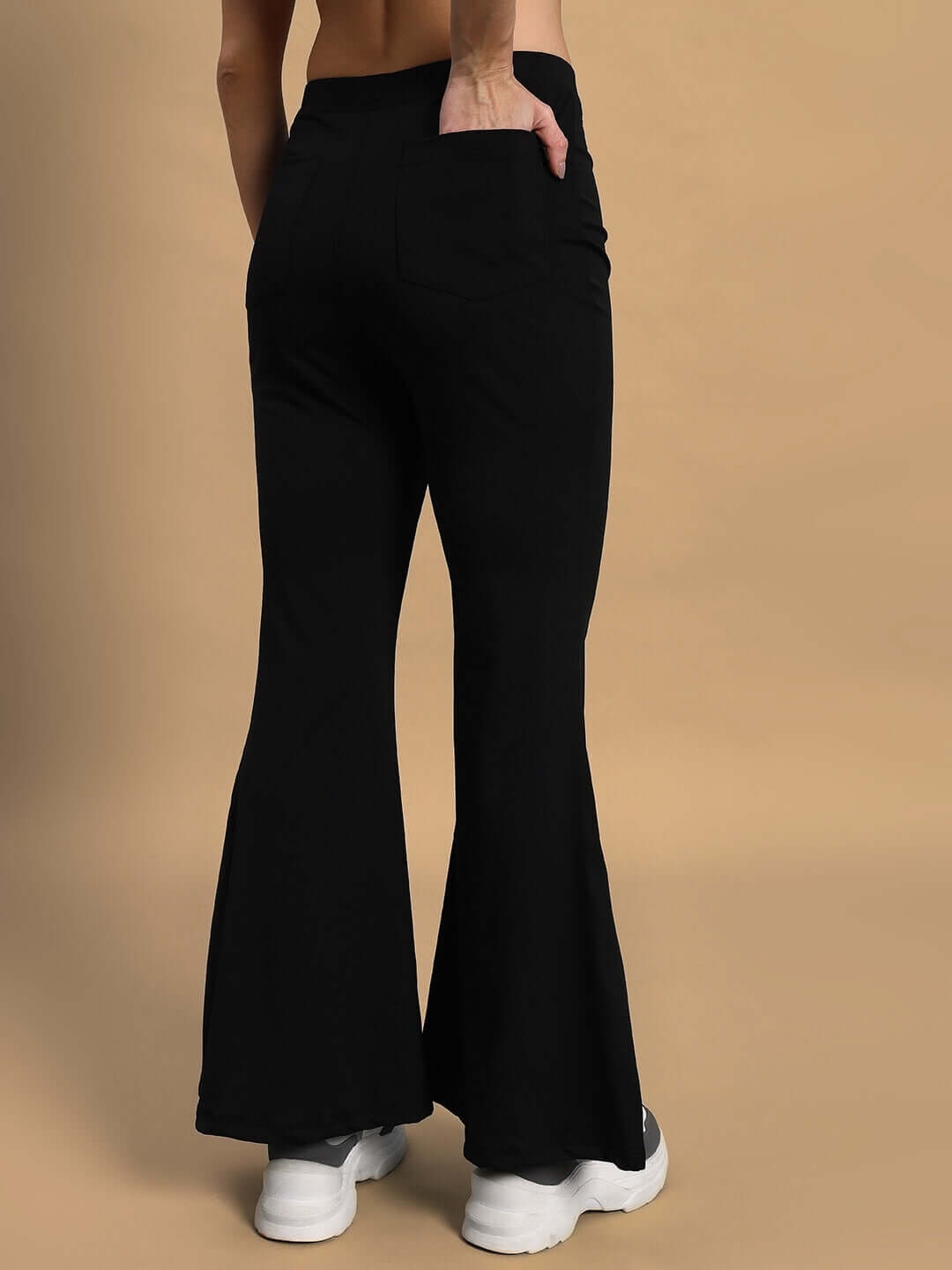 Back view of women's Stella boot cut pant in black, highlighting the flared design and comfortable fit.