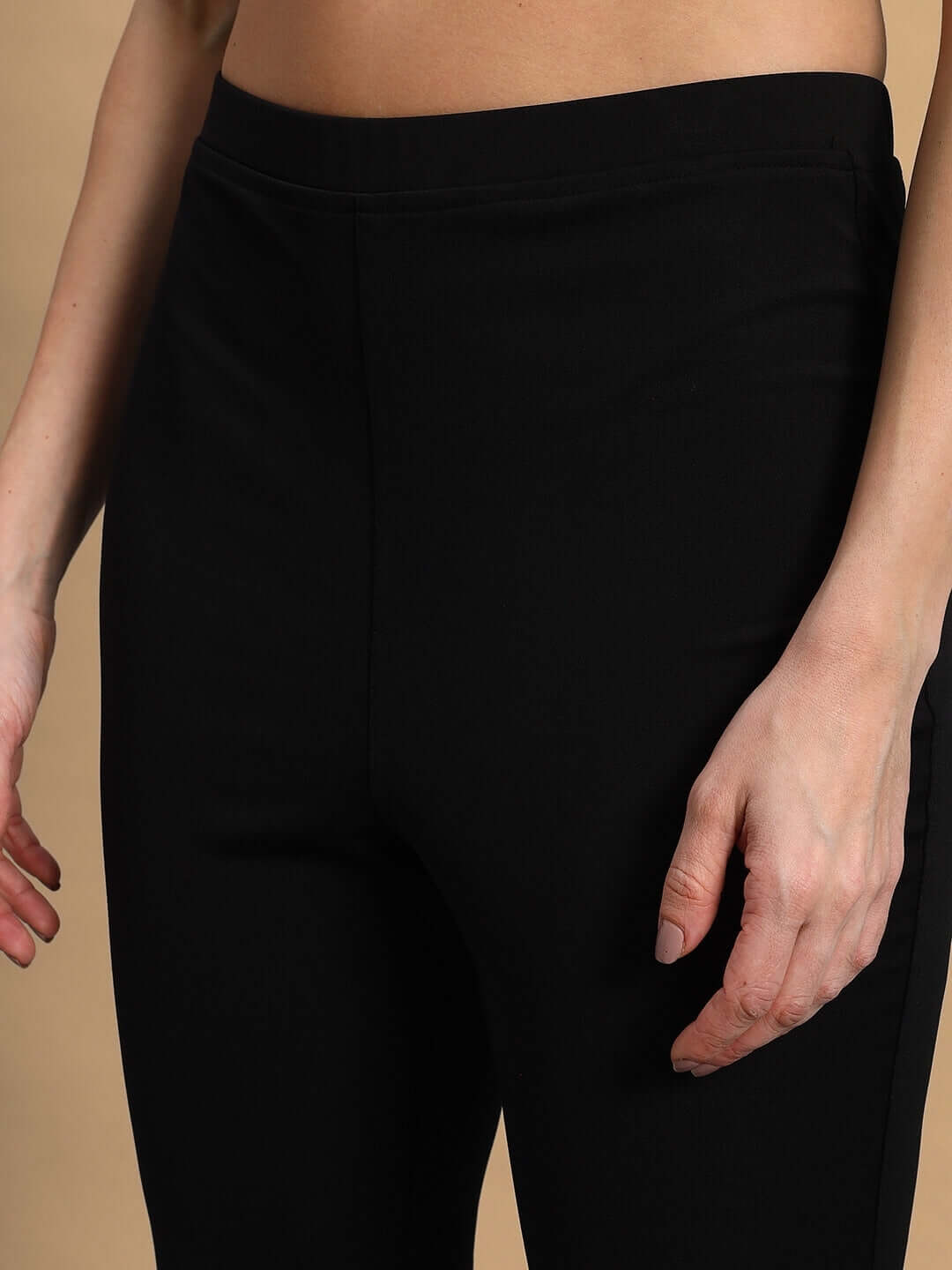 Close-up view of women's black Stella boot cut pants showcasing the tailored fit and quality craftsmanship.