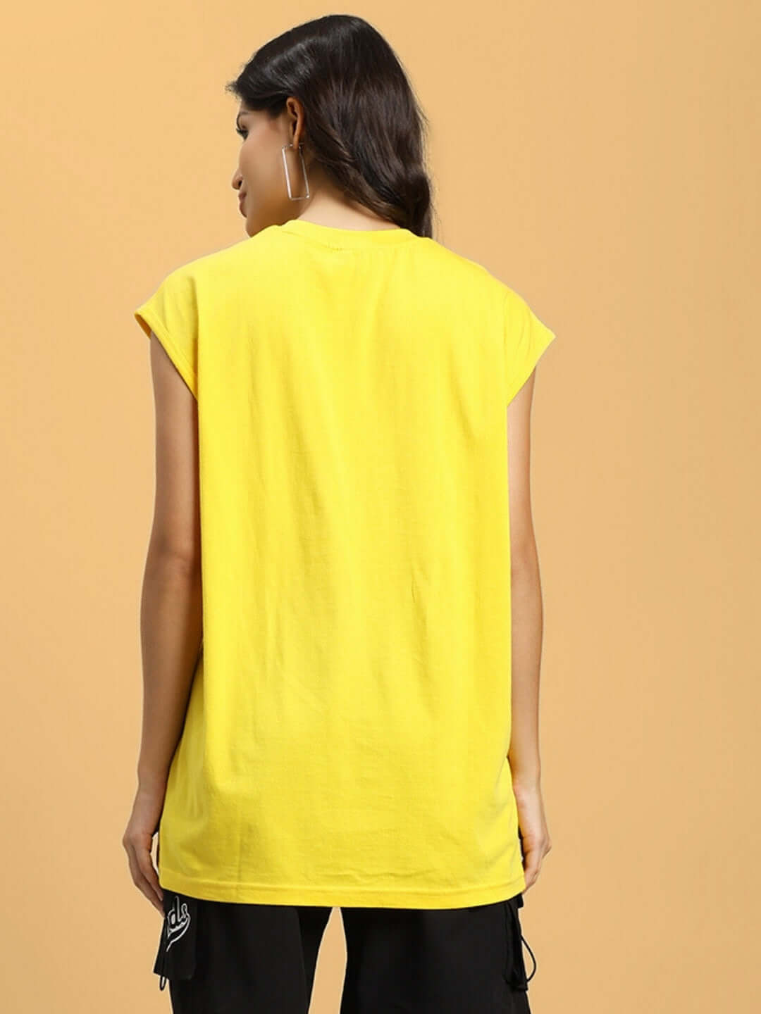 Rear view of woman wearing yellow Women's Street Lion Gym T-Shirt, highlighting casual fit with room for customization. Perfect for workouts.
