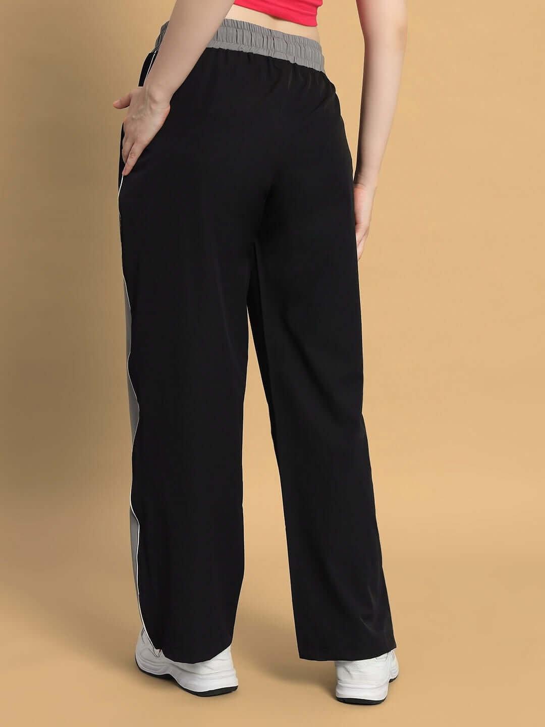 Women's black-grey cargo pants with relaxed fit, customizable size, back view. Ideal for comfort and style.