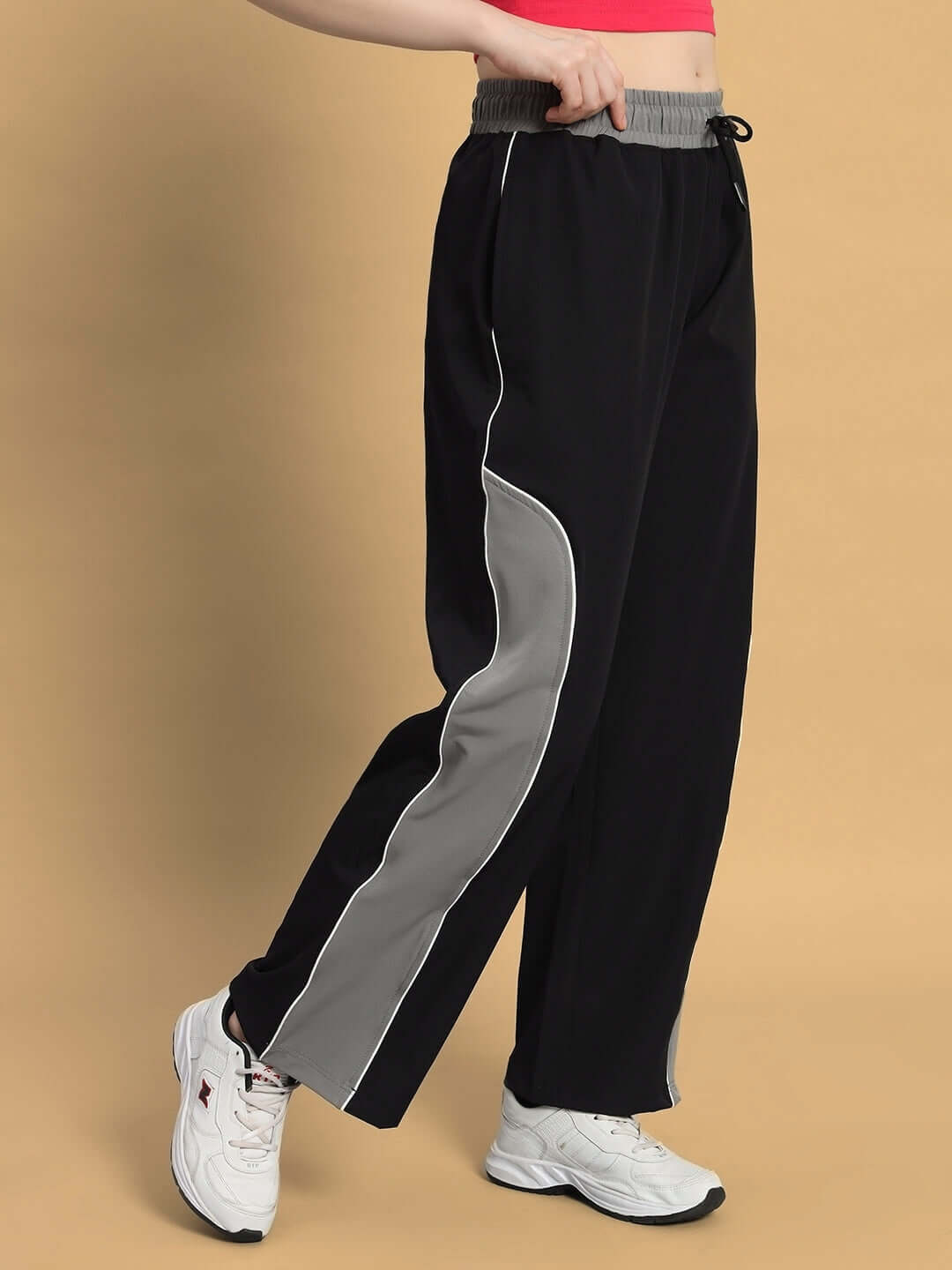 Black-grey women's relaxed fit cargo pants by DUDS with customizable size option, featuring a sporty design ideal for active wear.